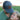 Man wearing a cap with 'Dad' patch and a young girl sitting on his lap outdoors.